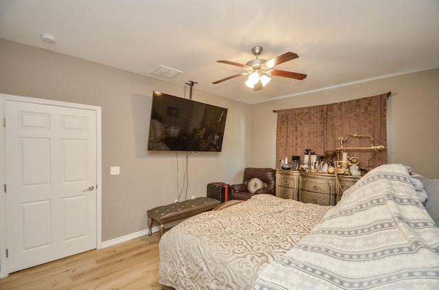 bedroom featuring ceiling fan and light hardwood / wood-style floors