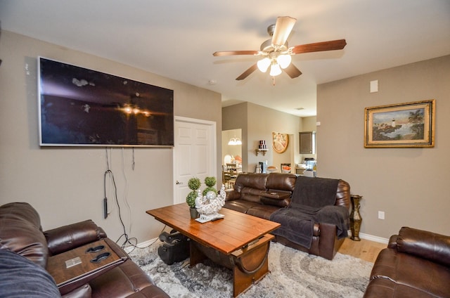 living room with ceiling fan and light hardwood / wood-style floors