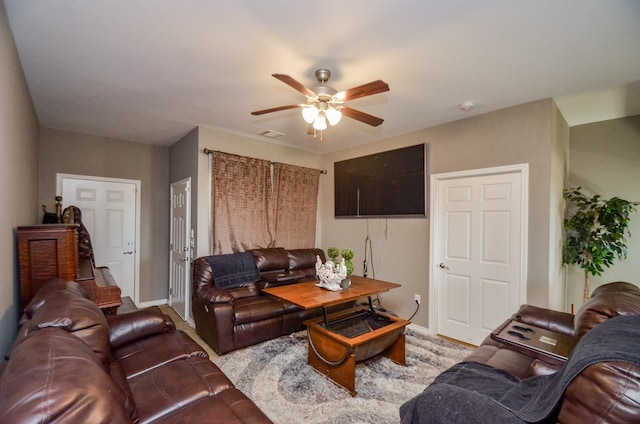 living room featuring ceiling fan