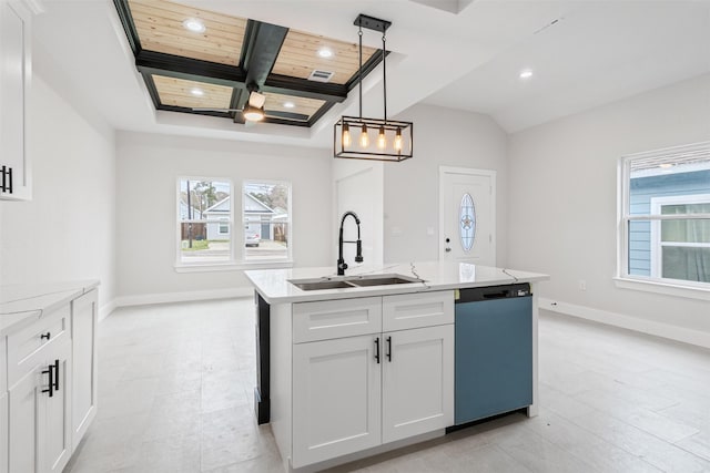 kitchen featuring sink, black dishwasher, white cabinets, and a kitchen island with sink