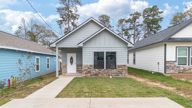 bungalow with a front yard