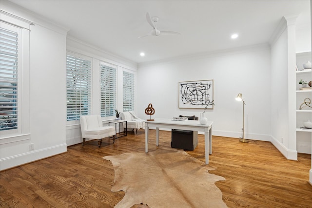 home office featuring hardwood / wood-style flooring, ceiling fan, and ornamental molding