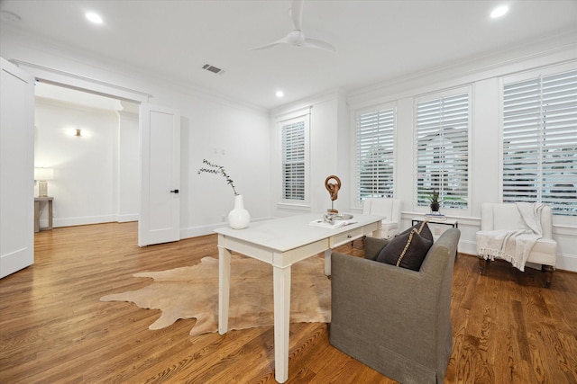 office area featuring ceiling fan, hardwood / wood-style flooring, and crown molding