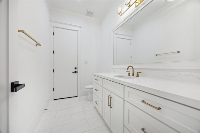 bathroom featuring toilet, tile patterned flooring, vanity, and ornamental molding