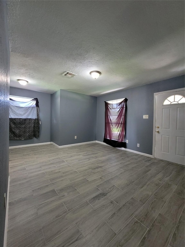 empty room with a textured ceiling