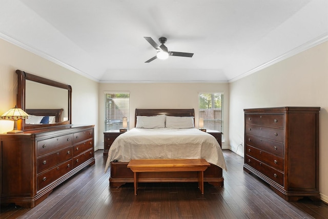 bedroom featuring lofted ceiling, ceiling fan, ornamental molding, and dark hardwood / wood-style floors