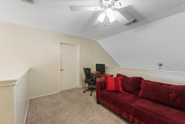 office area featuring lofted ceiling, light carpet, and ceiling fan