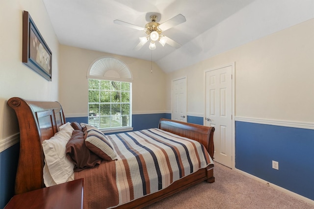 carpeted bedroom with lofted ceiling and ceiling fan