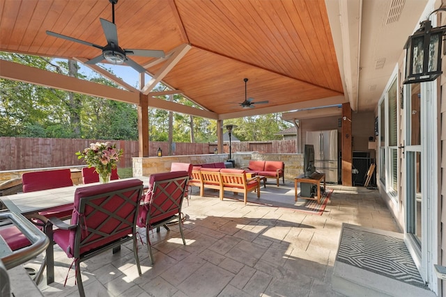 view of patio featuring ceiling fan and an outdoor living space