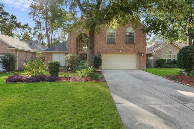 view of front facade featuring a front lawn and a garage