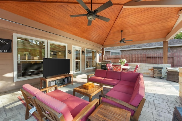 view of patio featuring ceiling fan, an outdoor hangout area, and grilling area