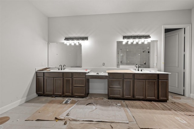 bathroom with walk in shower and vanity