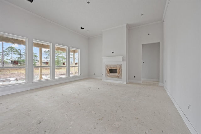 unfurnished living room featuring a high end fireplace and ornamental molding