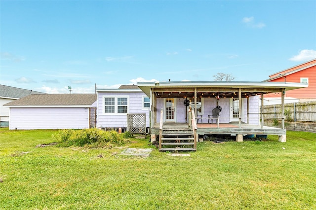 back of house featuring a yard