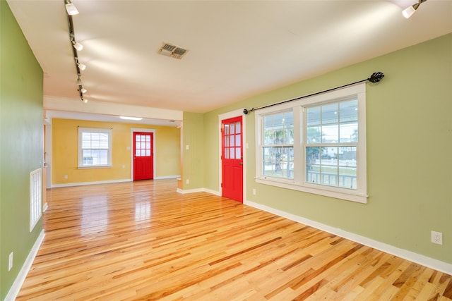 entryway featuring track lighting and light wood-type flooring