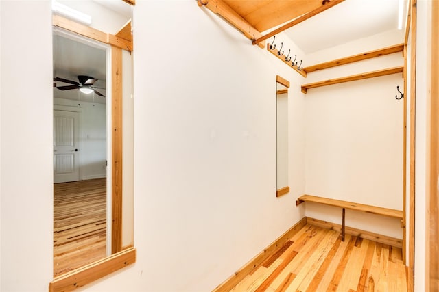 interior space featuring wood-type flooring and ceiling fan