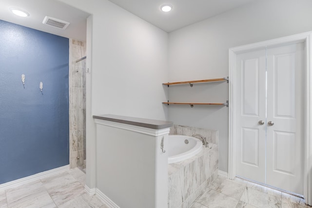 bathroom featuring separate shower and tub