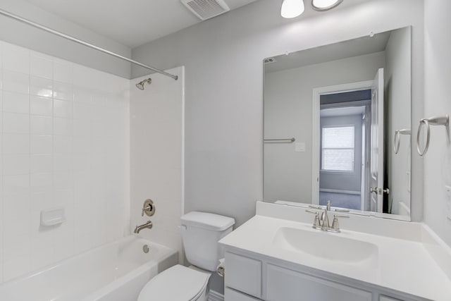 full bathroom featuring toilet, vanity, and tiled shower / bath