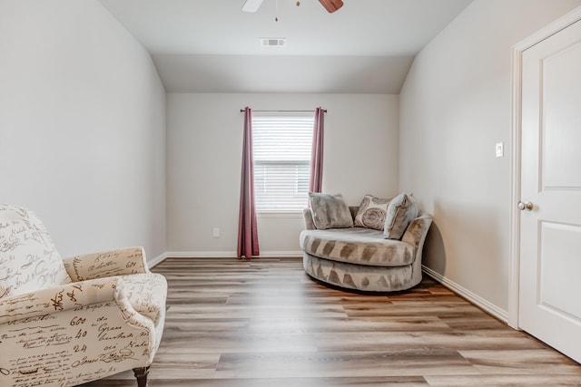 sitting room featuring lofted ceiling, ceiling fan, and light hardwood / wood-style flooring