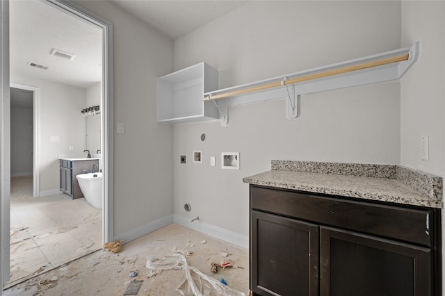 clothes washing area featuring electric dryer hookup, hookup for a gas dryer, and washer hookup