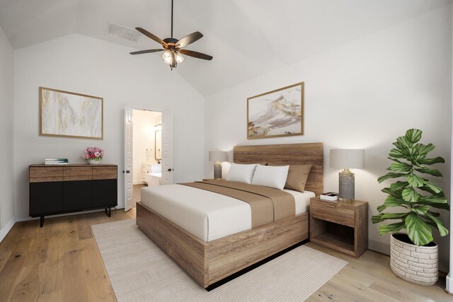 bedroom with ceiling fan, light hardwood / wood-style floors, ensuite bathroom, and vaulted ceiling