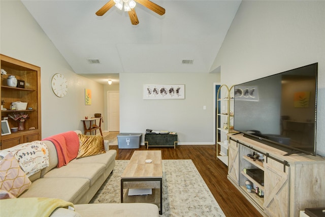 living room with ceiling fan, vaulted ceiling, and dark hardwood / wood-style floors