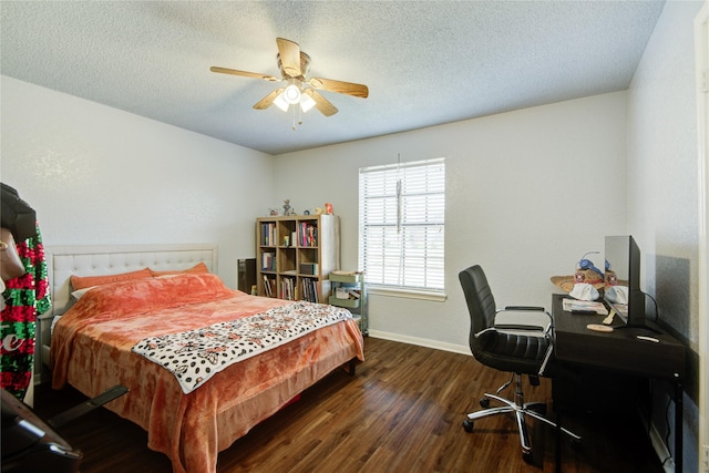 bedroom with a textured ceiling, ceiling fan, and dark hardwood / wood-style floors