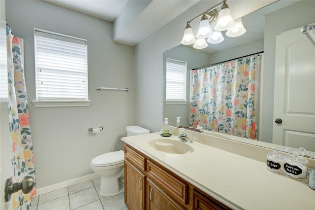 bathroom with toilet, tile patterned floors, and vanity