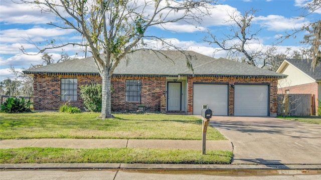 ranch-style home with a garage and a front lawn