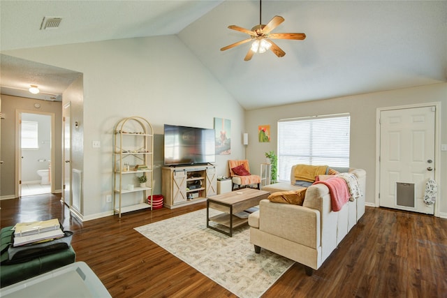 living room featuring lofted ceiling, ceiling fan, and dark hardwood / wood-style floors