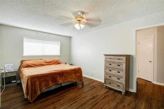 bedroom with ceiling fan and dark wood-type flooring