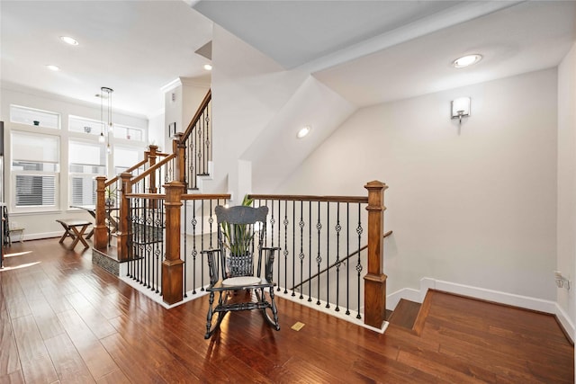 staircase with recessed lighting, crown molding, baseboards, and wood finished floors