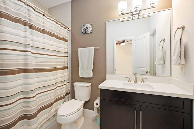 bathroom featuring toilet, tile patterned flooring, vanity, and a ceiling fan