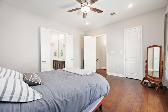 bedroom with recessed lighting, dark wood-style flooring, visible vents, baseboards, and ensuite bath