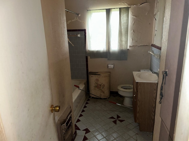 bathroom with toilet and vanity