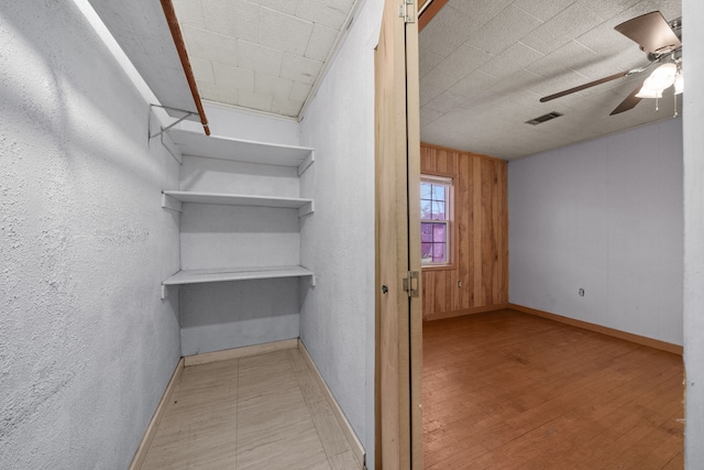 interior space featuring ceiling fan