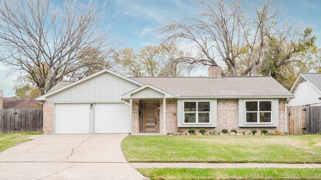 ranch-style house with a front lawn and a garage