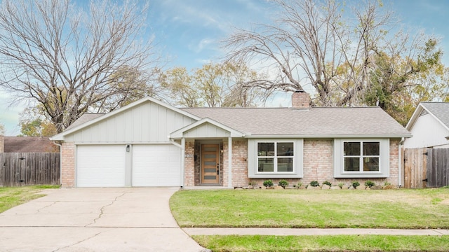 single story home featuring a front lawn and a garage