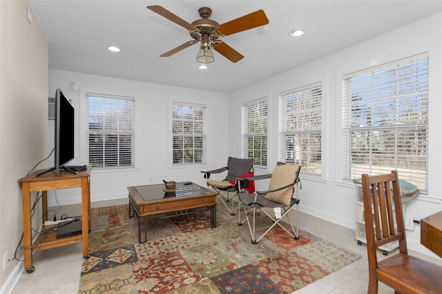 sitting room featuring ceiling fan