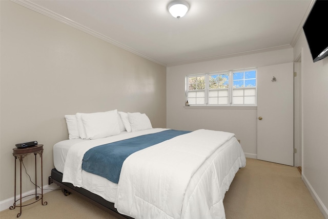 bedroom with ornamental molding and light colored carpet