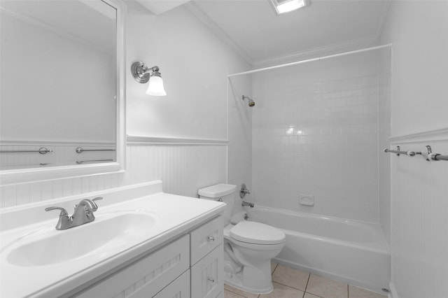 full bathroom featuring toilet, tile patterned flooring, ornamental molding, tiled shower / bath, and vanity