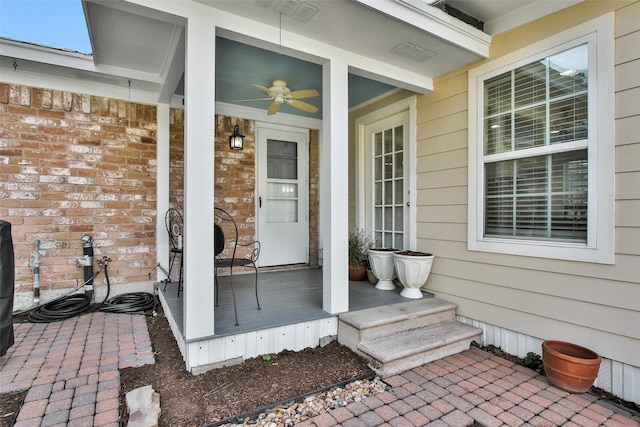 property entrance featuring ceiling fan