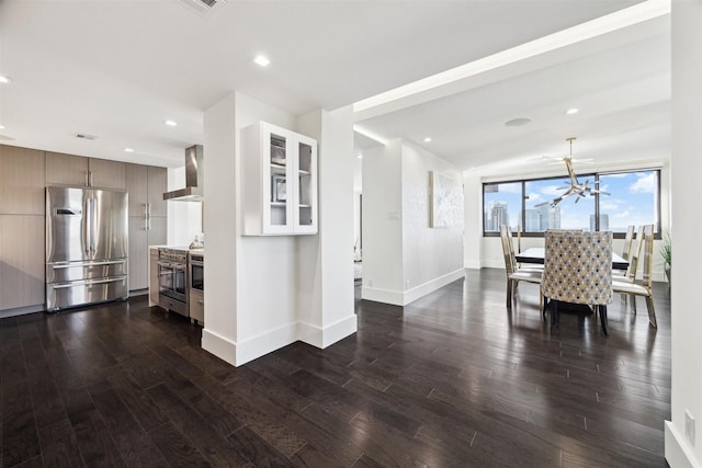 dining area with a notable chandelier and dark hardwood / wood-style floors