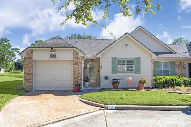 single story home featuring a front yard and a garage