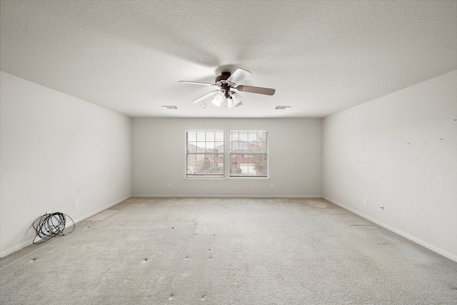 empty room with light carpet and ceiling fan