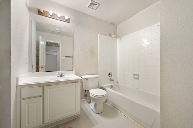 full bathroom featuring toilet, vanity, and tiled shower / bath combo