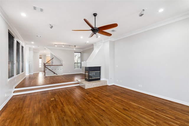 unfurnished living room with crown molding, a multi sided fireplace, ceiling fan, and hardwood / wood-style floors