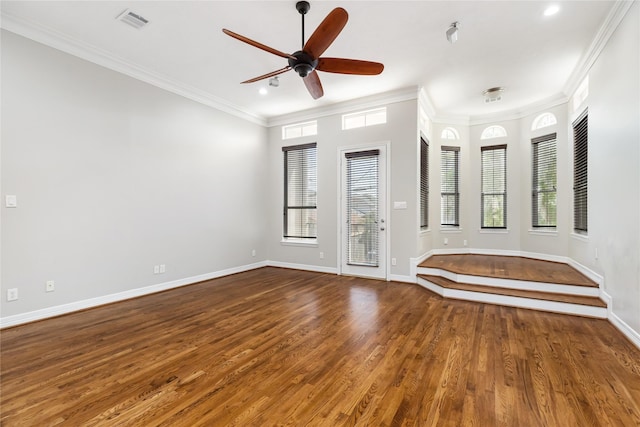 spare room with crown molding, hardwood / wood-style floors, and ceiling fan