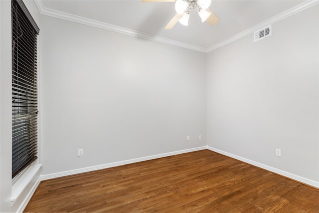 empty room with crown molding, hardwood / wood-style flooring, and ceiling fan