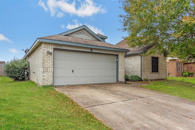 view of front of house with a front yard and a garage